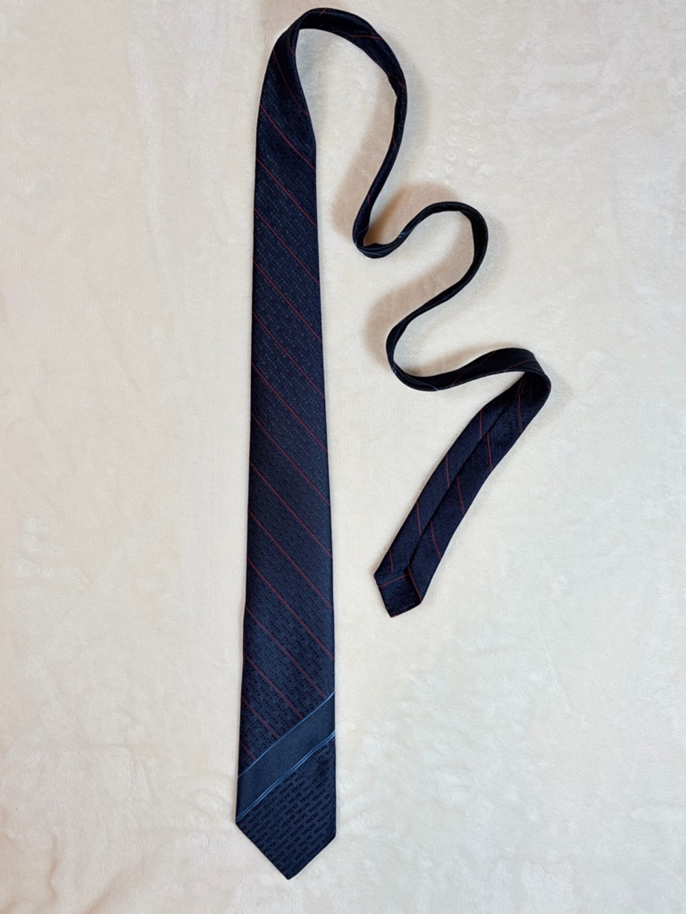 Embroidered “Volvo” Navy Tie with Subtle Red Stripe by Portia